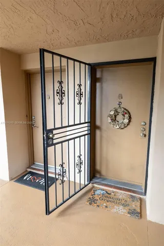 a view of a livingroom with furniture and a chandelier