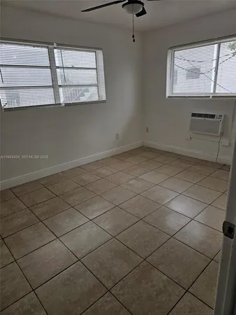 a view of an empty room and window