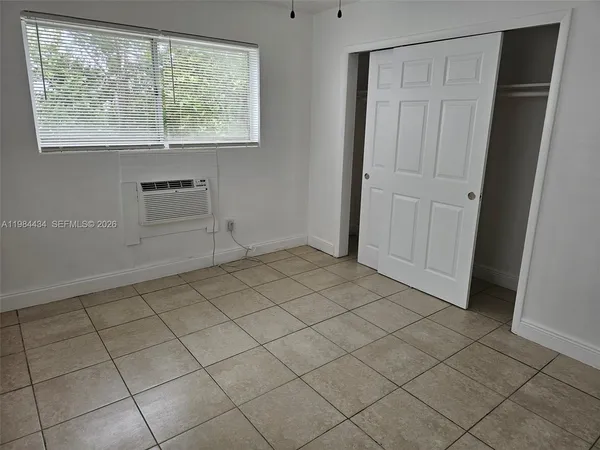an empty room with white walls