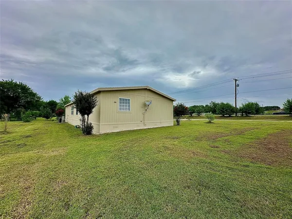 a house view with garden space