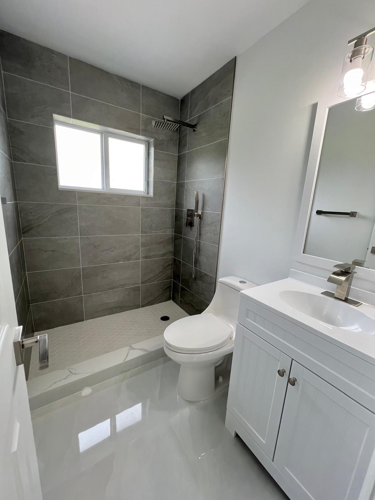 22575 Lanyard Street Boca Raton, FL 33428 - Photo 21 of 27 a bathroom with a sink a toilet and shower