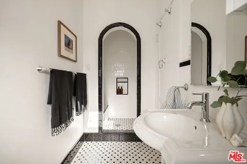 a patio with a table and chairs