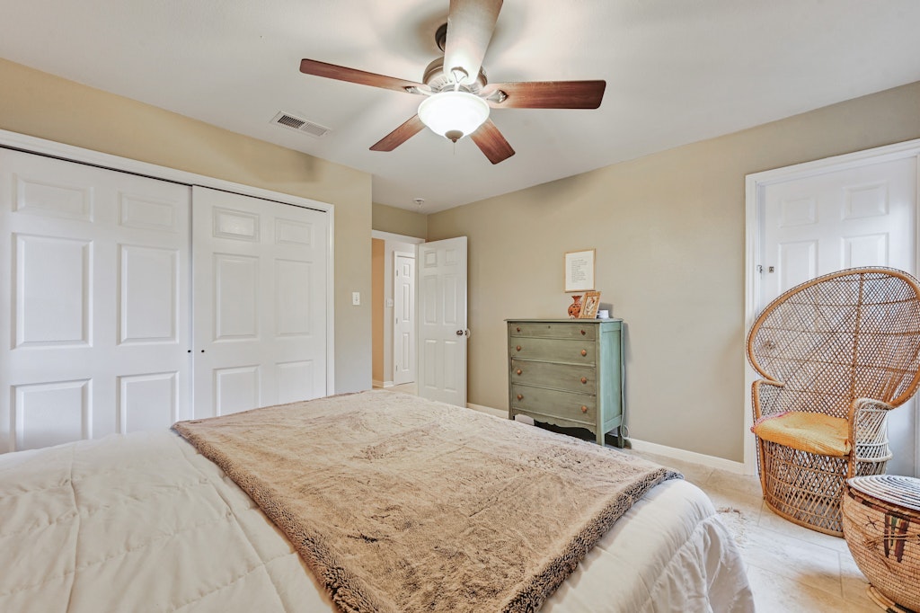 4025 Valley View Road, Unit 2 Austin, TX 78704 - Photo 11 of 19 a bedroom with a large bed and a chandelier