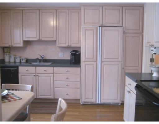 27 Gilbert Road Needham, MA 02492 - Photo 5 of 10 a kitchen with granite countertop white cabinets and sink