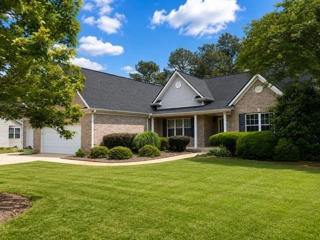 1218 Morgans Run Monroe, GA 30656 - Photo 2 of 39 a front view of a house with a yard