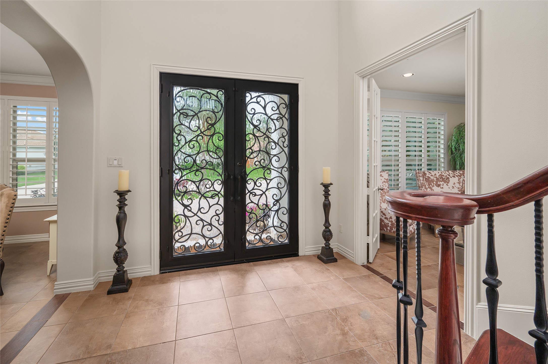 2127 Thicket Ridge Lane Houston, TX 77077 - Photo 6 of 48 The custom double-hinged wrought iron doors welcome you into the large foyer which leads to the striking wood and wrought iron staircase.