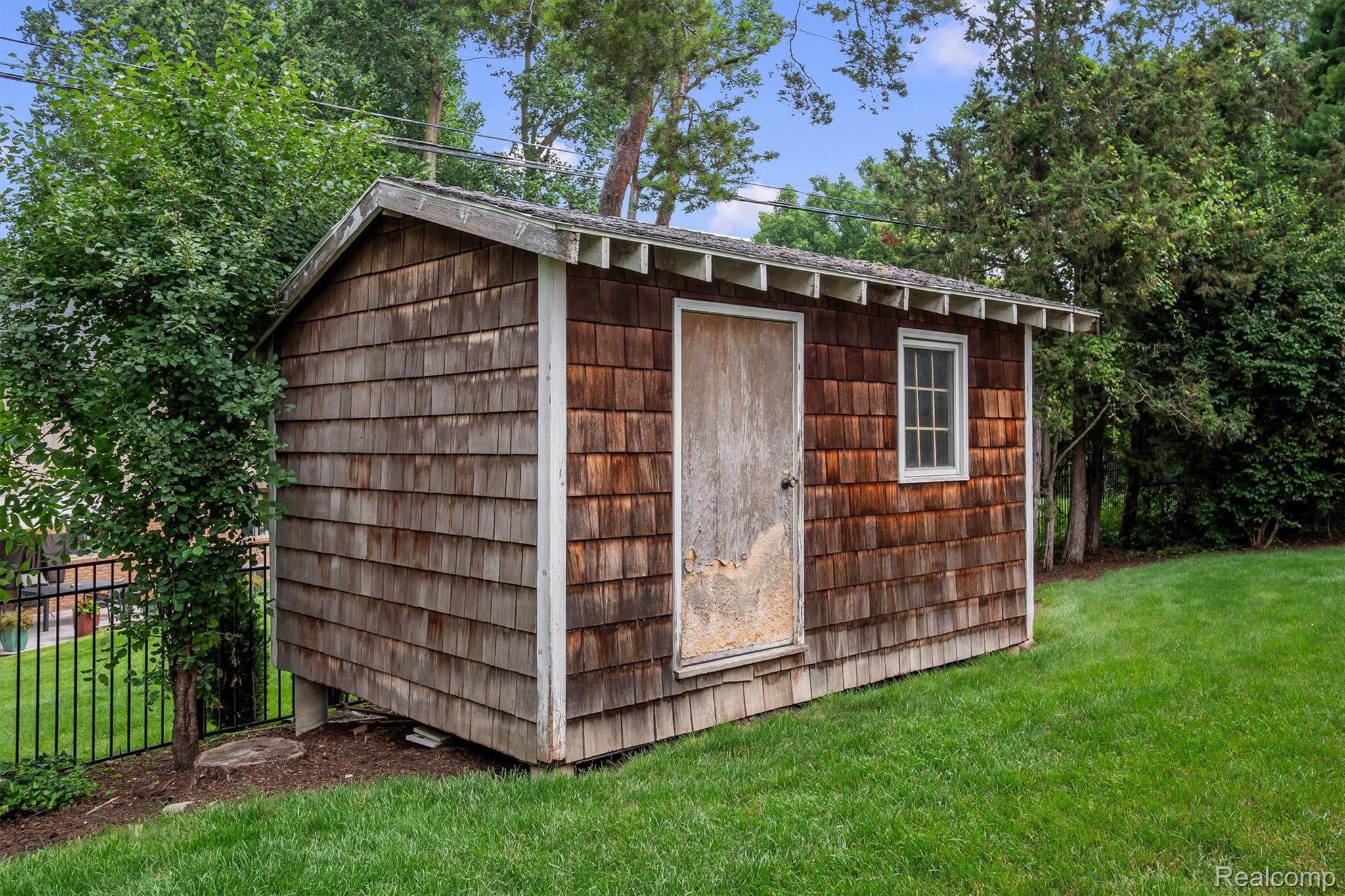 1151 Peveril Road Bloomfield Hills, MI 48304 - Photo 39 of 39 Wood-shingle exterior storage shed with a window and a shingled roofline