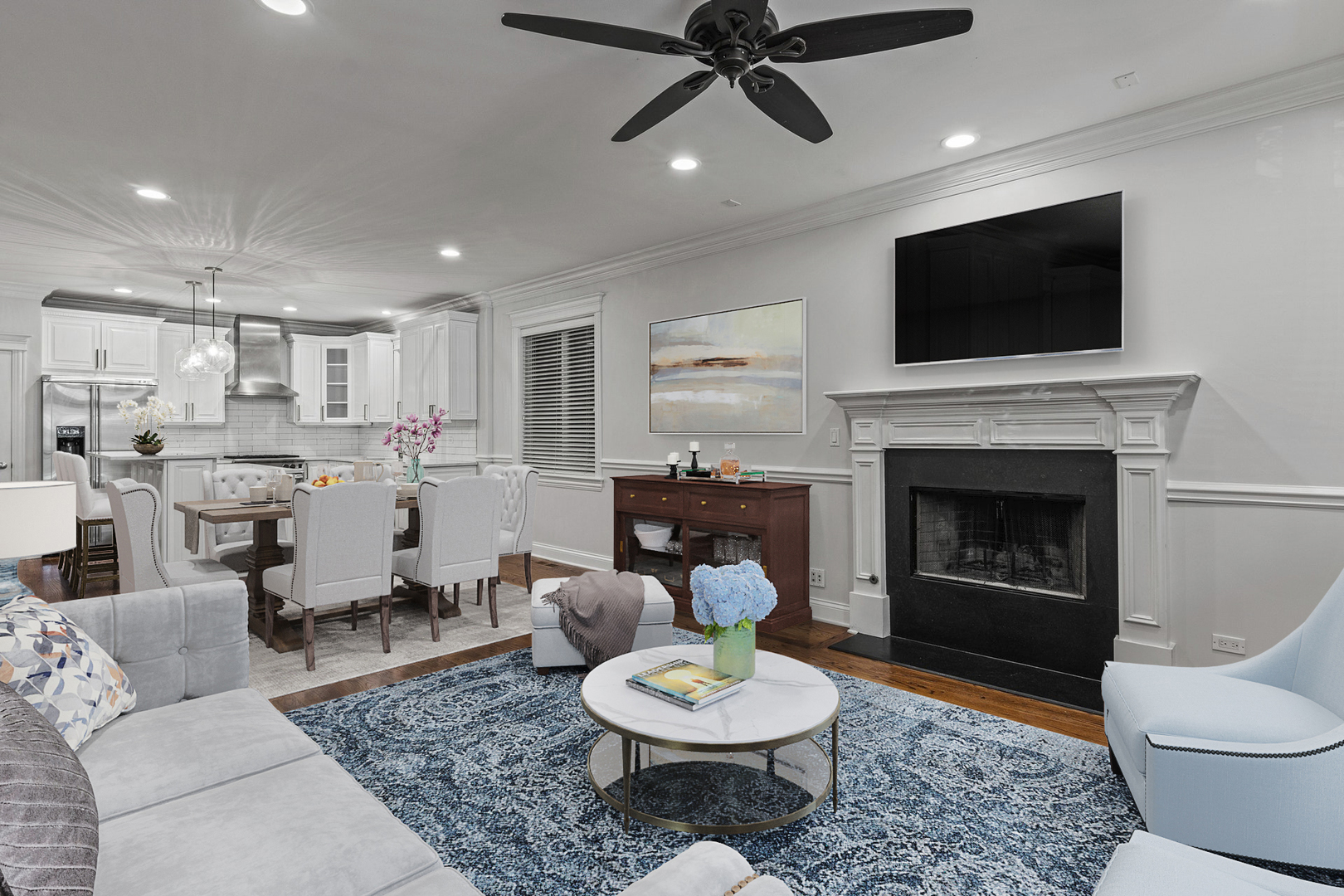 1049 West Monroe Street, Unit 1 Chicago, IL 60607 - Photo 2 of 22 a living room with furniture a flat screen tv and a fireplace