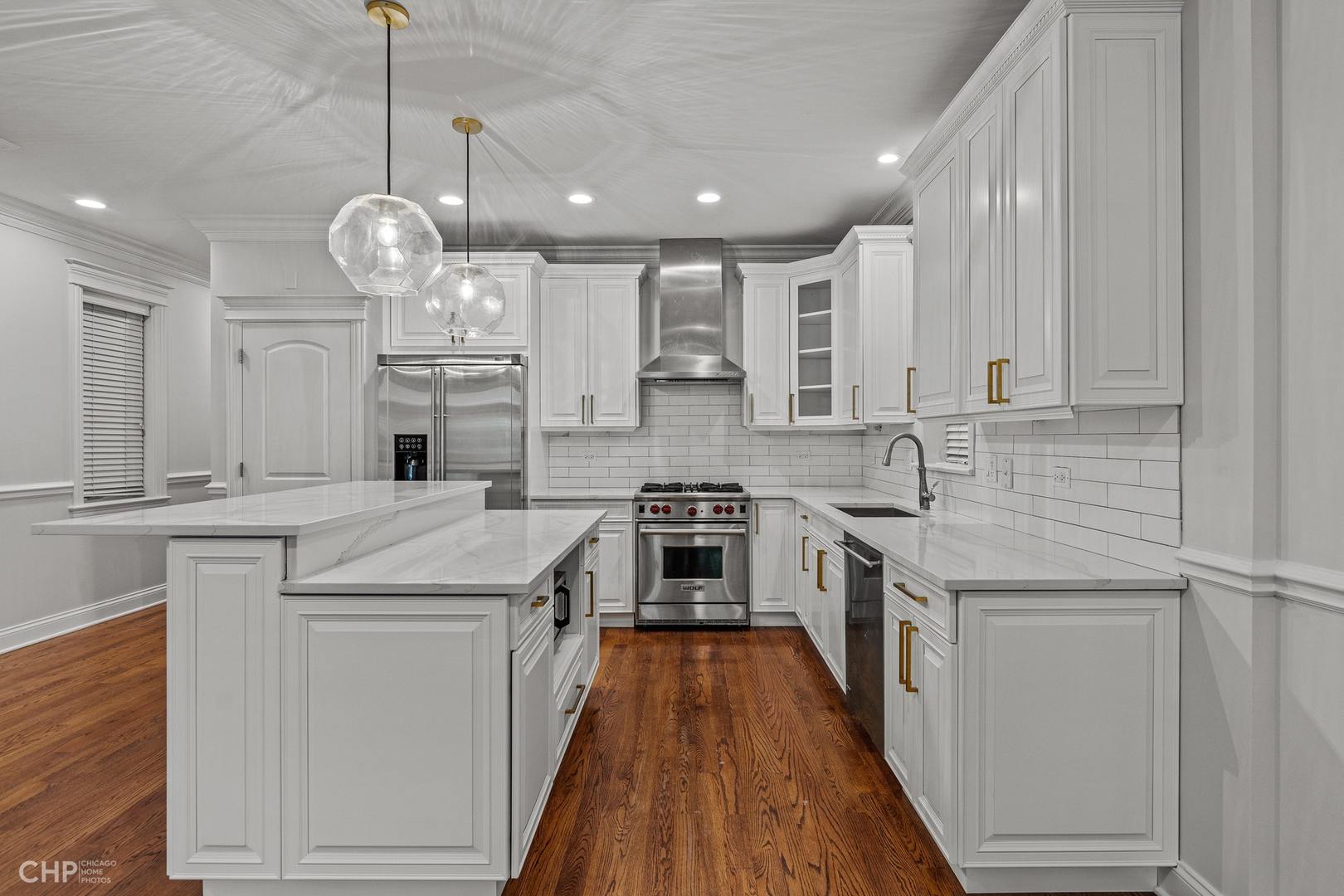 1049 West Monroe Street, Unit 1 Chicago, IL 60607 - Photo 7 of 22 a kitchen with stainless steel appliances granite countertop a stove and a sink