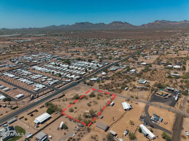 an aerial view of residential house and parking space