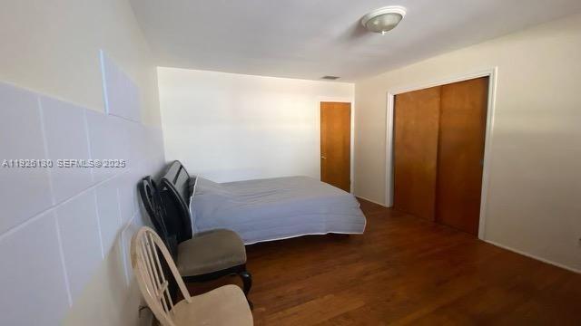 1843 Wiley Street, Unit 2 Hollywood, FL 33020 - Photo 14 of 15 a bedroom with furniture and a window