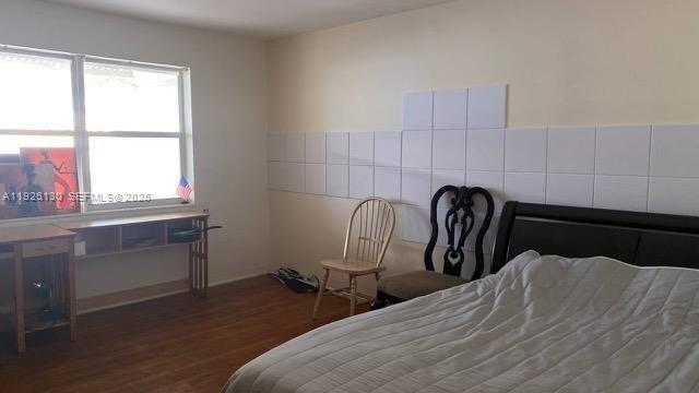 1843 Wiley Street, Unit 2 Hollywood, FL 33020 - Photo 10 of 15 a bedroom with bed and a window