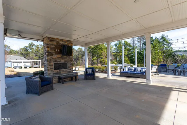 a view of living room with furniture and floor to ceiling window