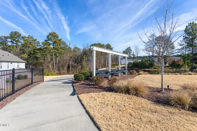 a view of a backyard with sitting area