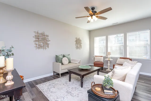 a living room with furniture and a table