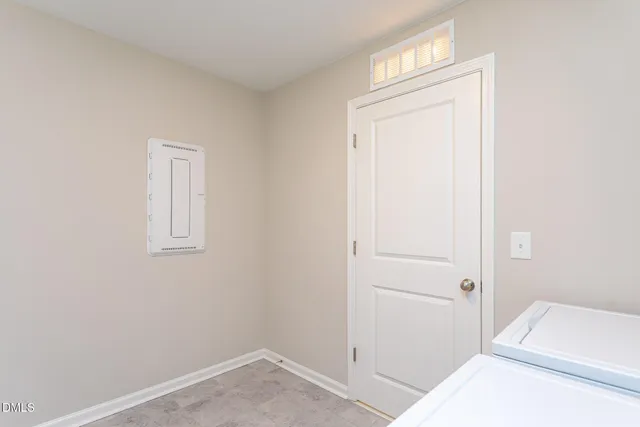 a room with a bed and a window