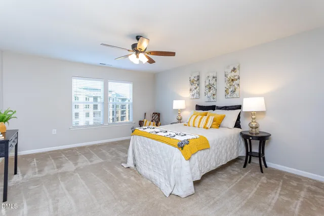 a spacious bedroom with a bed and a window