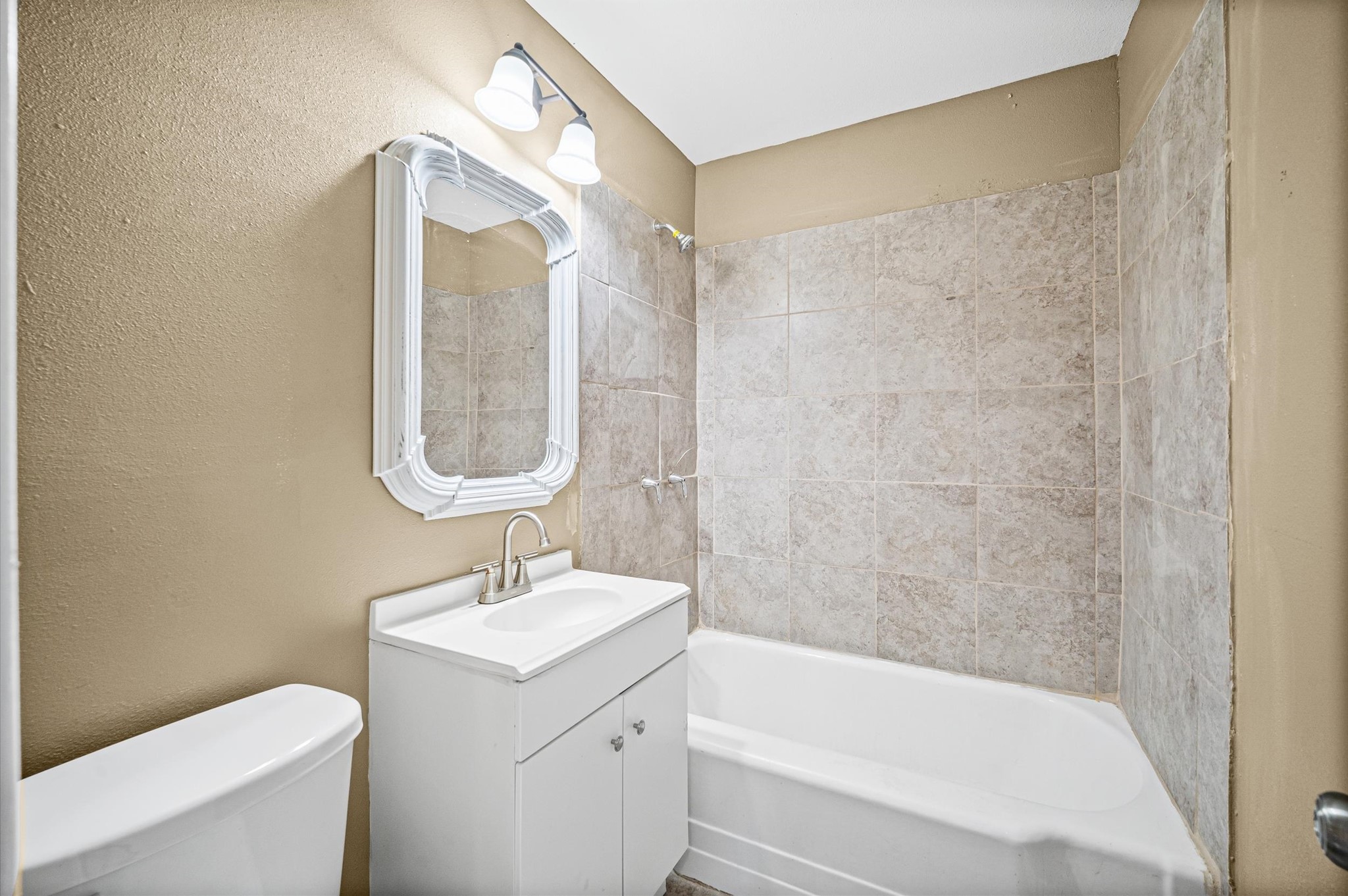 10621 Lane Street Houston, TX 77029 - Photo 12 of 29 a bathroom with a sink a toilet and shower