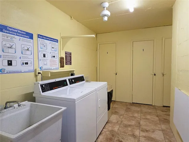 a view of a swimming pool with a yard