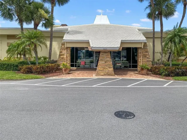 a room with furniture pool table and window