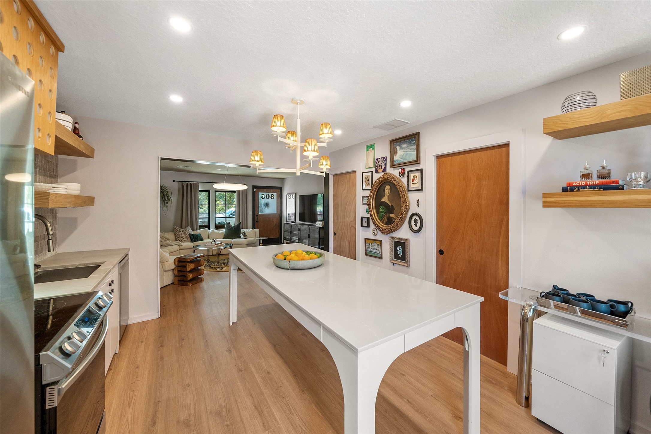 805 East 36th Street Houston, TX 77022 - Photo 11 of 28 a kitchen with a refrigerator a stove top oven a sink and a dishwasher