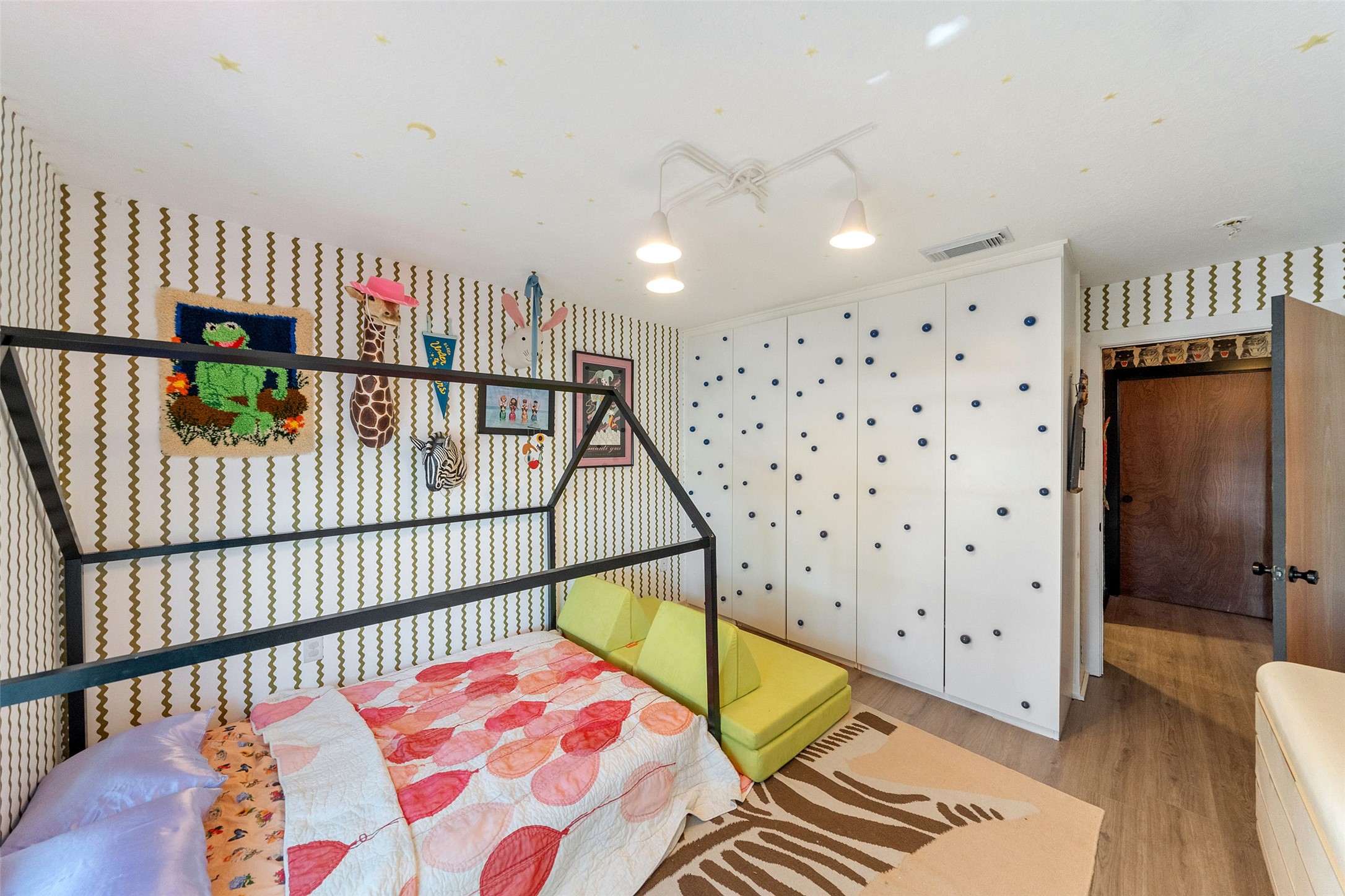 805 East 36th Street Houston, TX 77022 - Photo 18 of 28 a bedroom with furniture and a book shelf