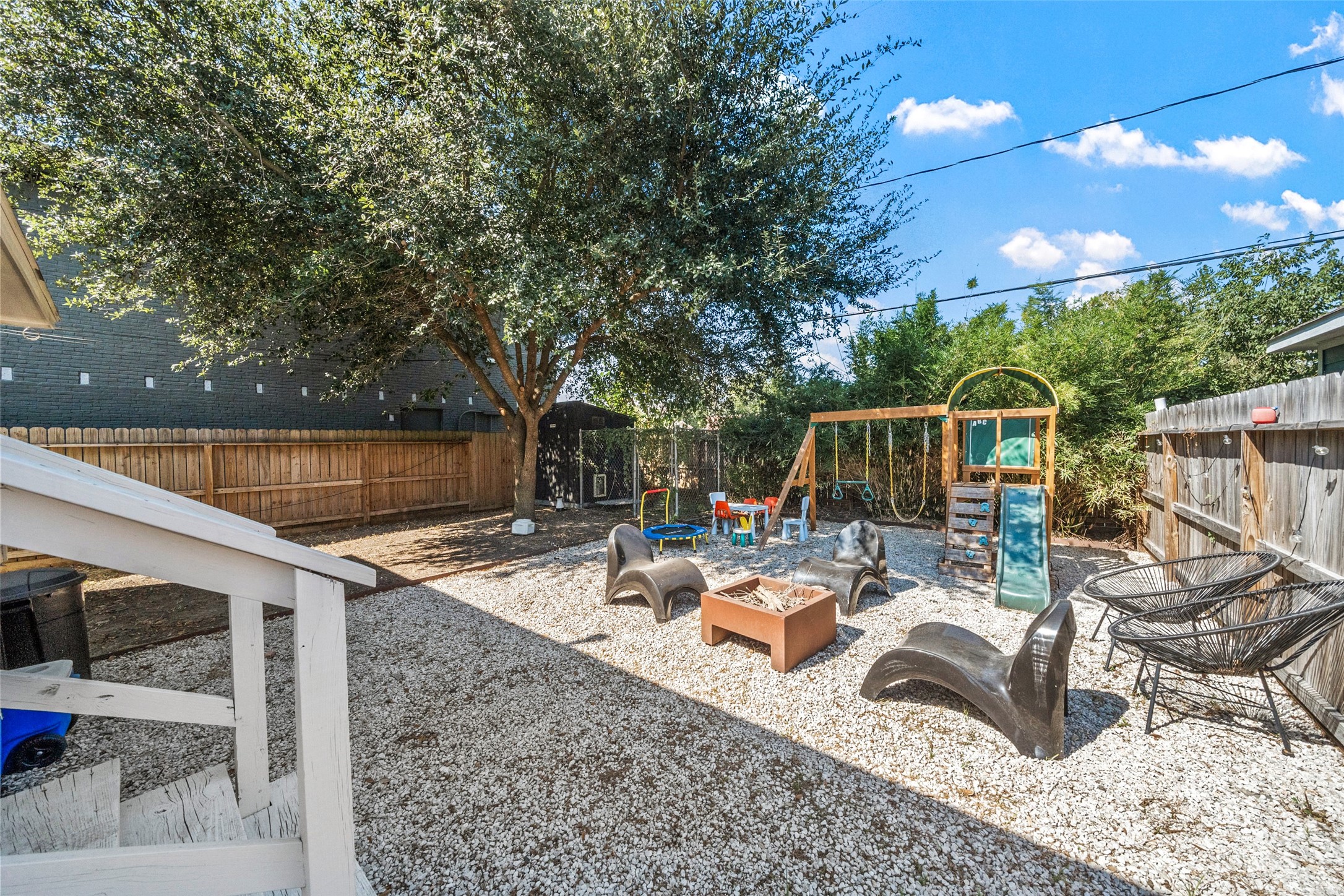 805 East 36th Street Houston, TX 77022 - Photo 24 of 28 a view of backyard with seating space and trees
