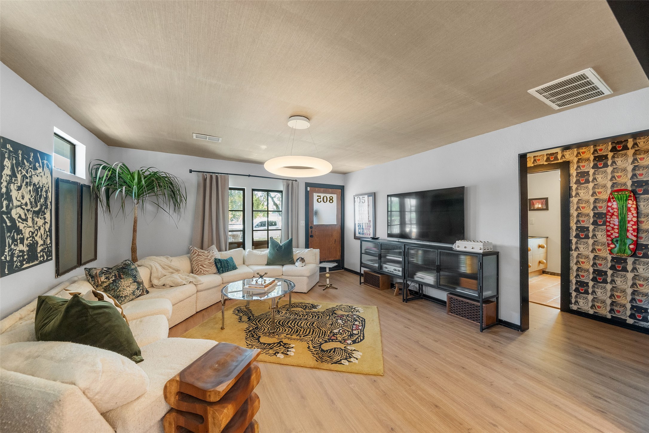 805 East 36th Street Houston, TX 77022 - Photo 5 of 28 a living room with furniture flat screen tv and a large window