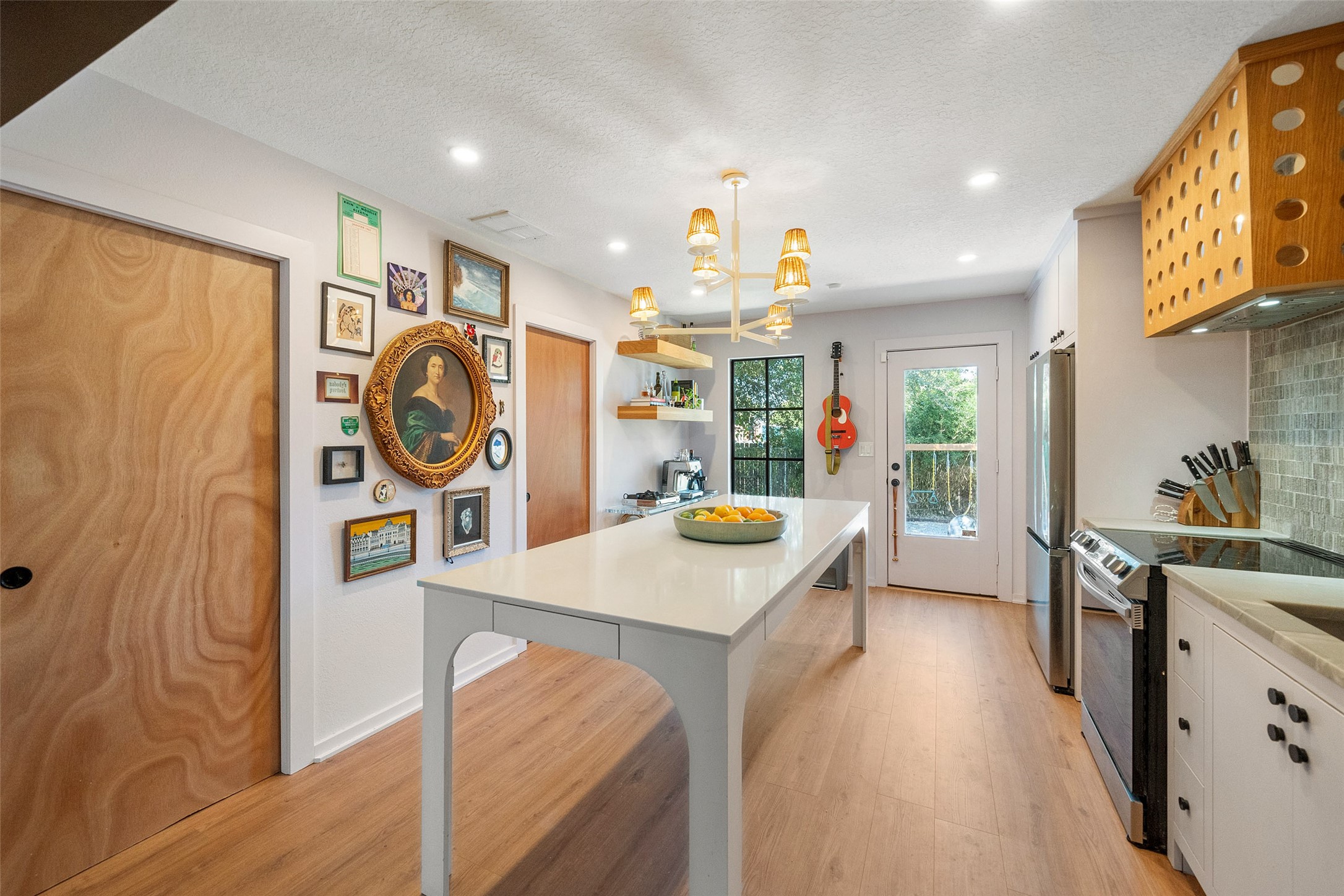 805 East 36th Street Houston, TX 77022 - Photo 9 of 28 a view of a kitchen area a sink wooden floor and windows