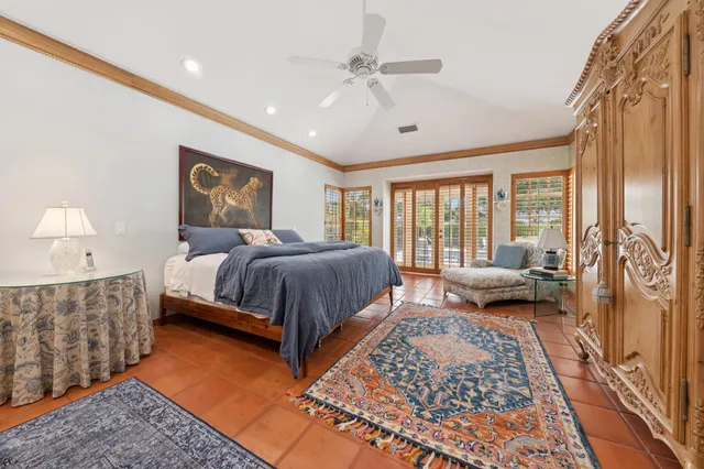 a bedroom with a large bed and a couch