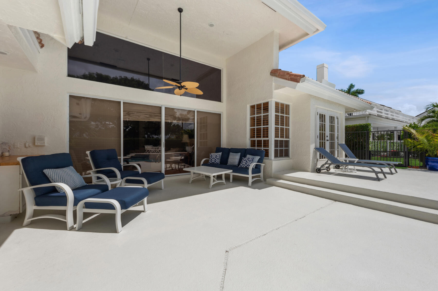 10403 Stonebridge Boulevard Boca Raton, FL 33498 - Photo 21 of 51 a building outdoor space with patio furniture and potted plants