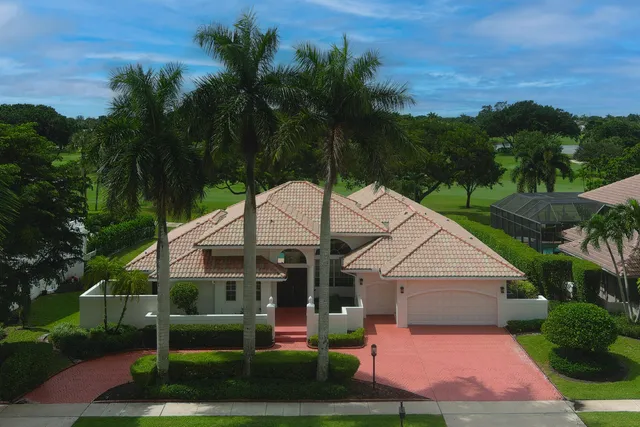 an aerial view of residential houses with outdoor space and street view