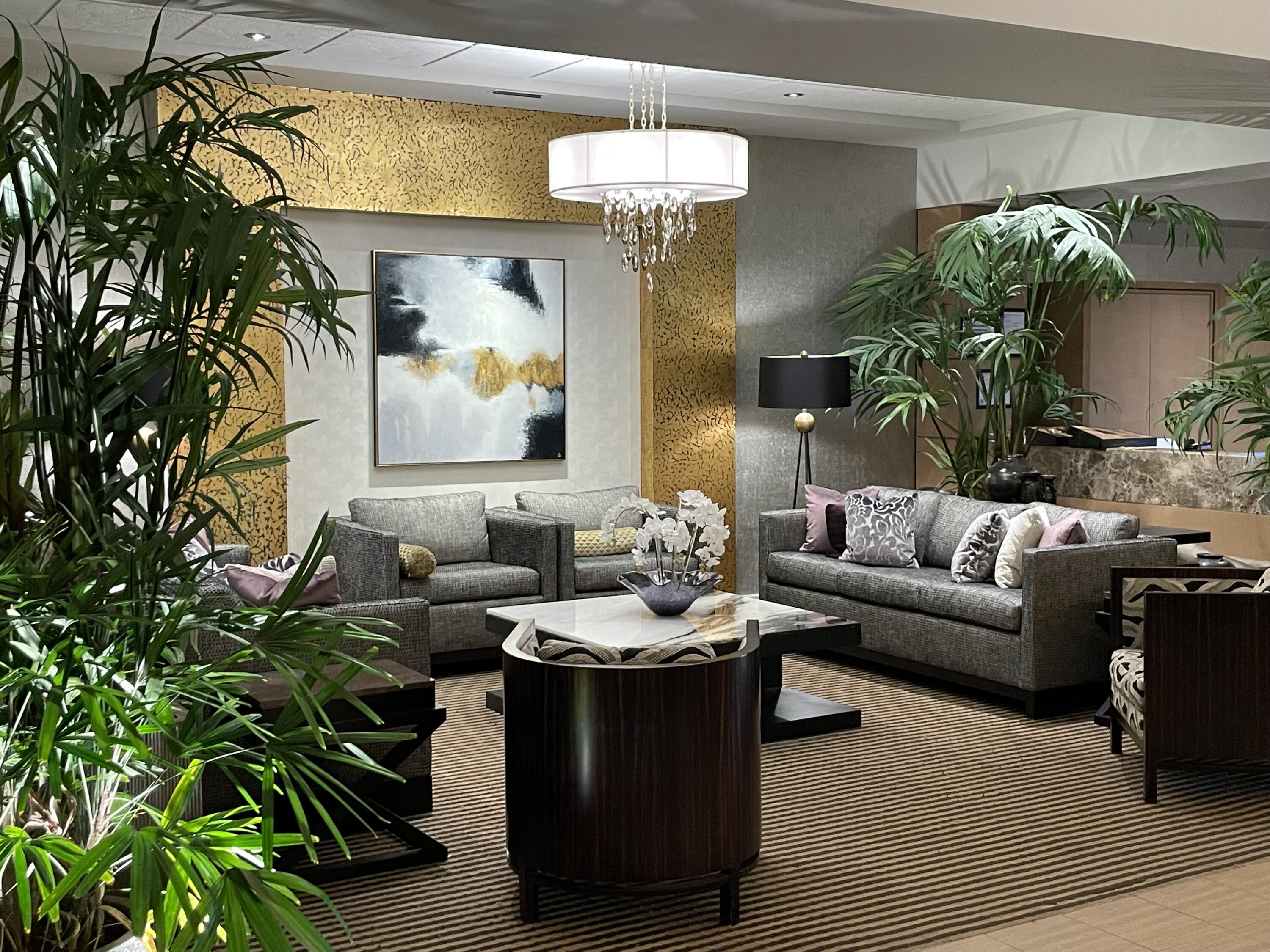 10403 Stonebridge Boulevard Boca Raton, FL 33498 - Photo 38 of 51 a living room with furniture and a potted plant