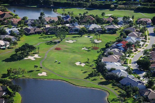 an aerial view of a house with outdoor space swimming pool and lake view