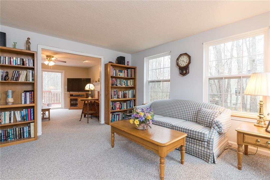 6 Westwoods Road Kennebunk, ME 04043 - Photo 6 of 34 The living room leads to the family...