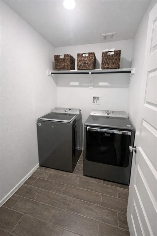 6609 Adderly Road Pilot Point, TX 76258 - Photo 14 of 15 a utility room with two washing machine