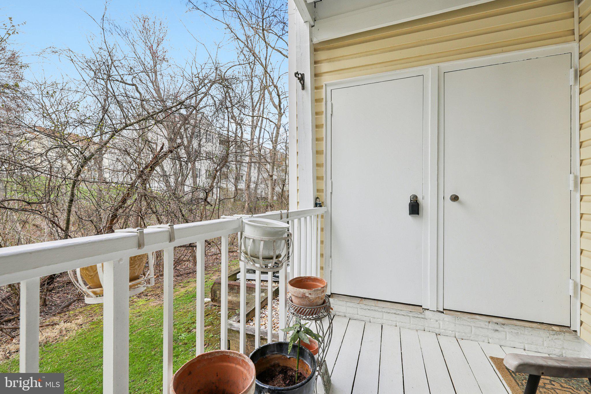 13 Pickering Court, Unit 1302 Germantown, MD 20874 - Photo 29 of 50 Backs to a stream and trees.