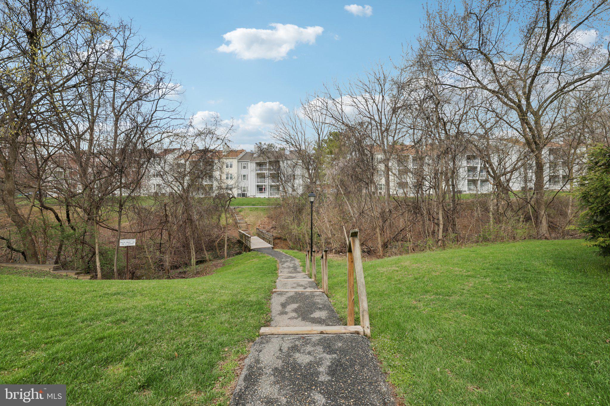 13 Pickering Court, Unit 1302 Germantown, MD 20874 - Photo 36 of 50 a view of a park with large trees