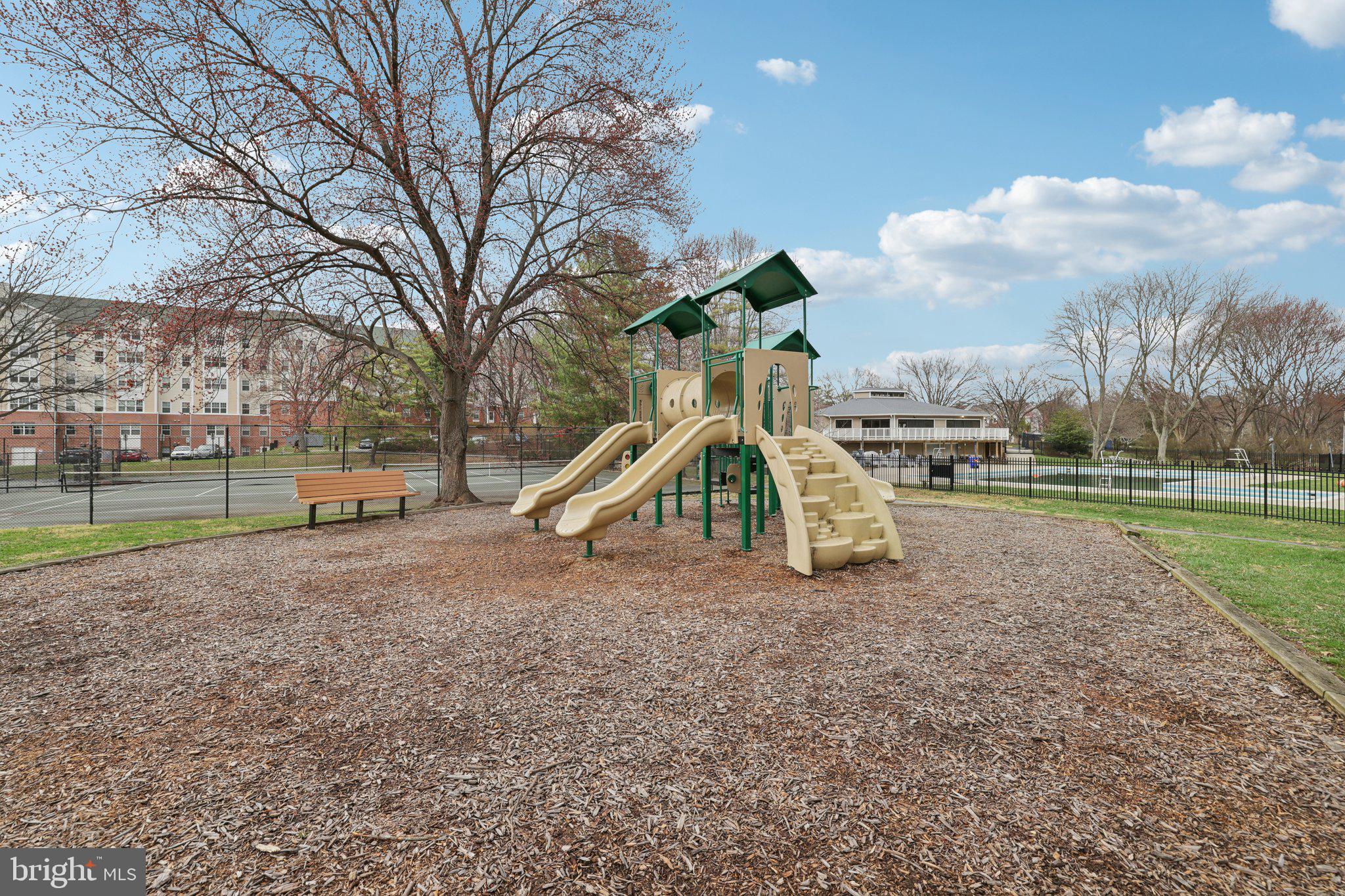 13 Pickering Court, Unit 1302 Germantown, MD 20874 - Photo 41 of 50 a view of outdoor space with playground and green space