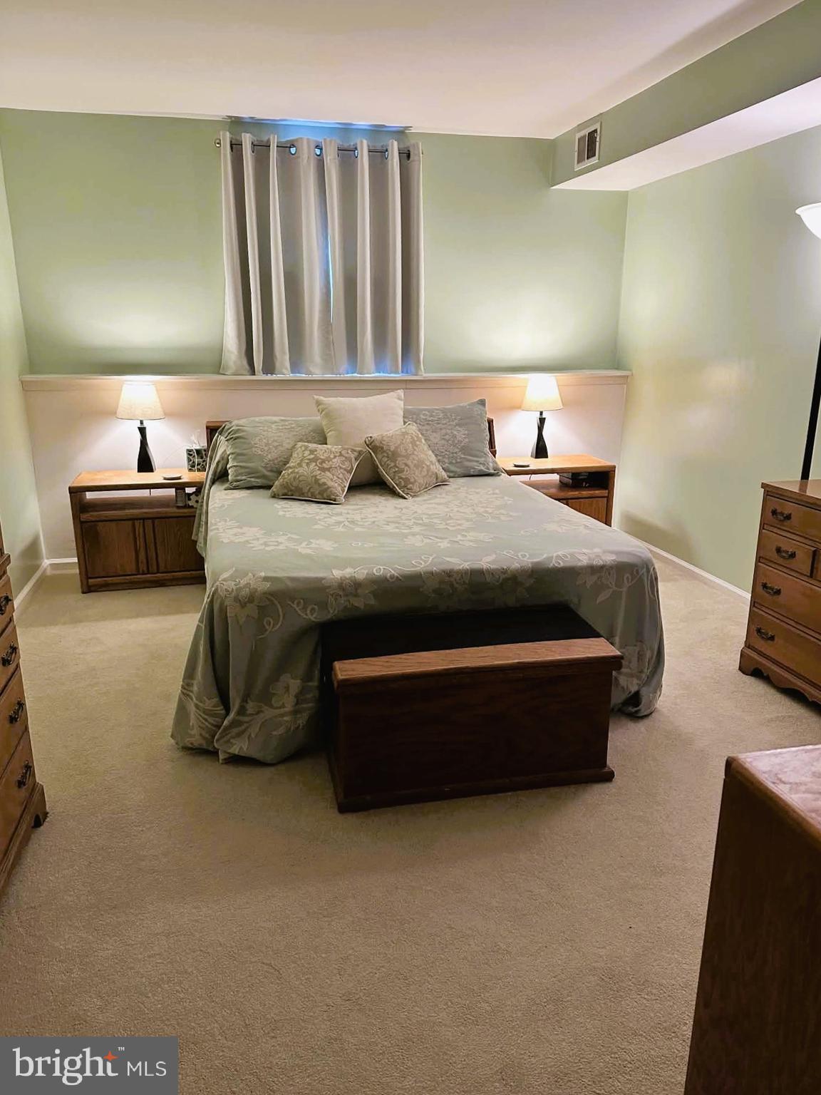 13 Pickering Court, Unit 1302 Germantown, MD 20874 - Photo 50 of 50 a spacious bedroom with a bed and a couch