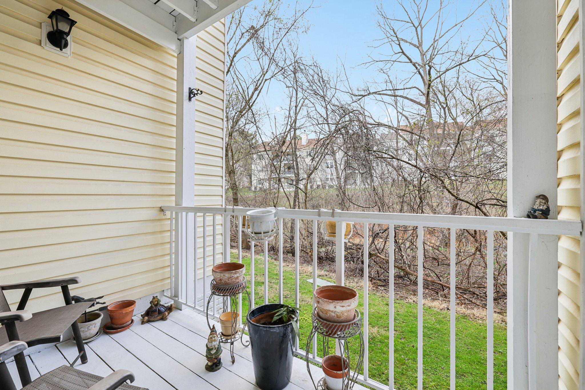 13 Pickering Court, Unit 1302 Germantown, MD 20874 - Photo 6 of 50 a view of a chair and fire pit in the backyard