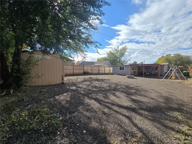 a view of backyard and tree