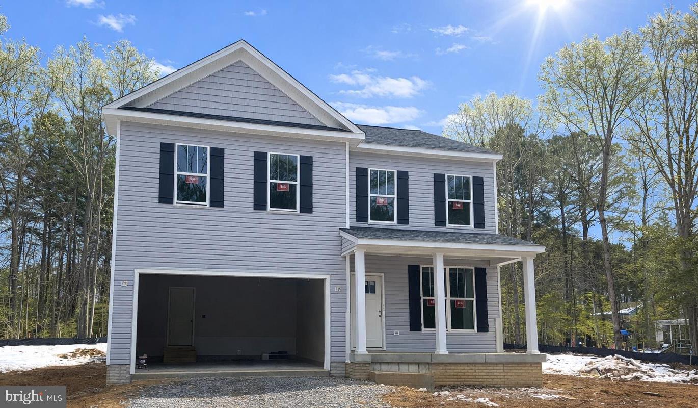 502 Smith Drive Ruther Glen, VA 22546 - Photo 2 of 36 a front view of a house with a porch