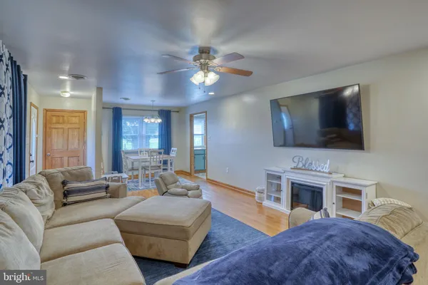 a living room with furniture fireplace and a flat screen tv