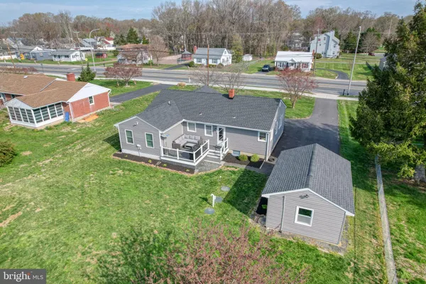 an aerial view of a house with outdoor space and pool view