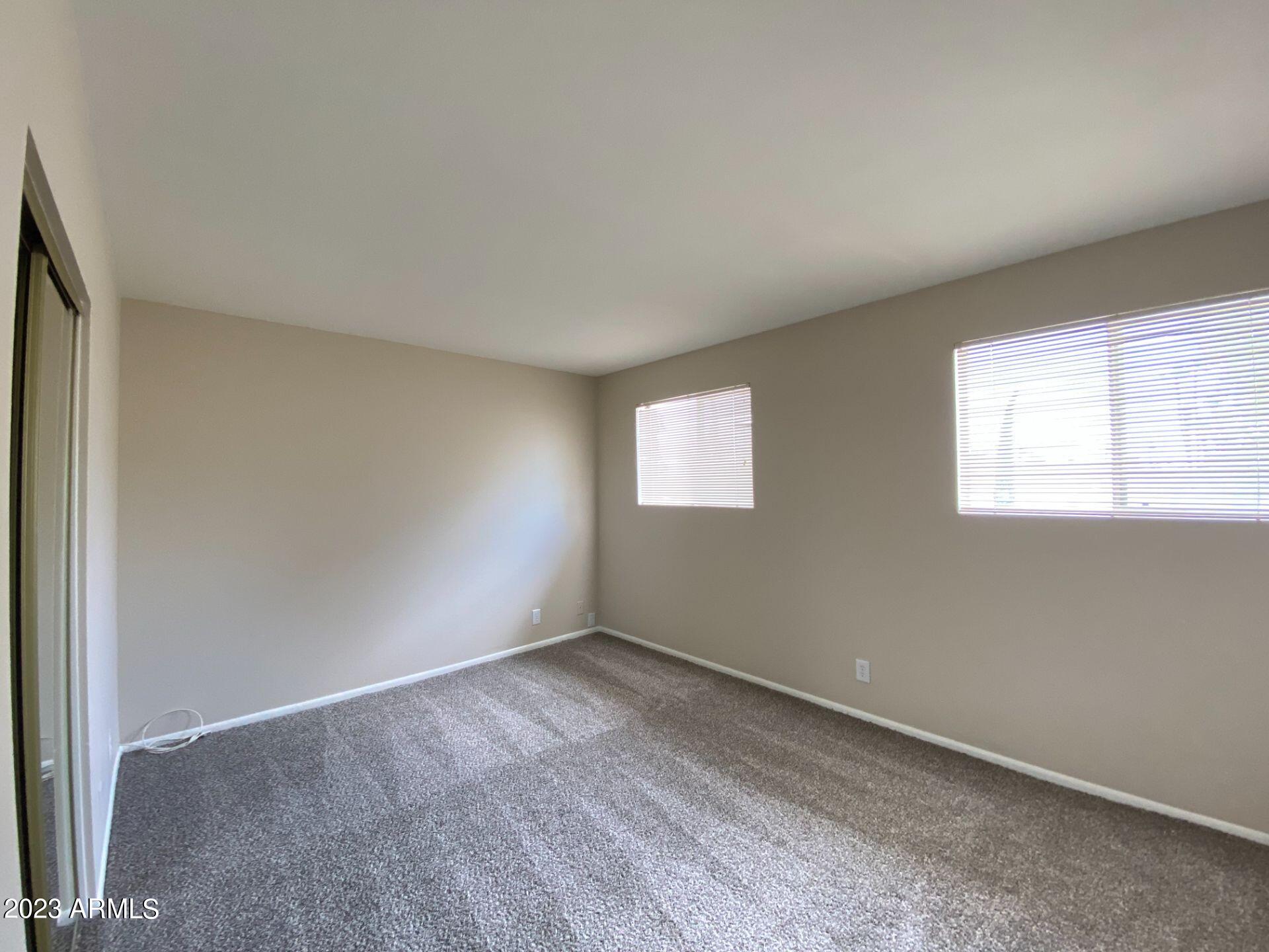 17024 East Calle Del Oro, Unit B Fountain Hills, AZ 85268 - Photo 13 of 22 an empty room with a window