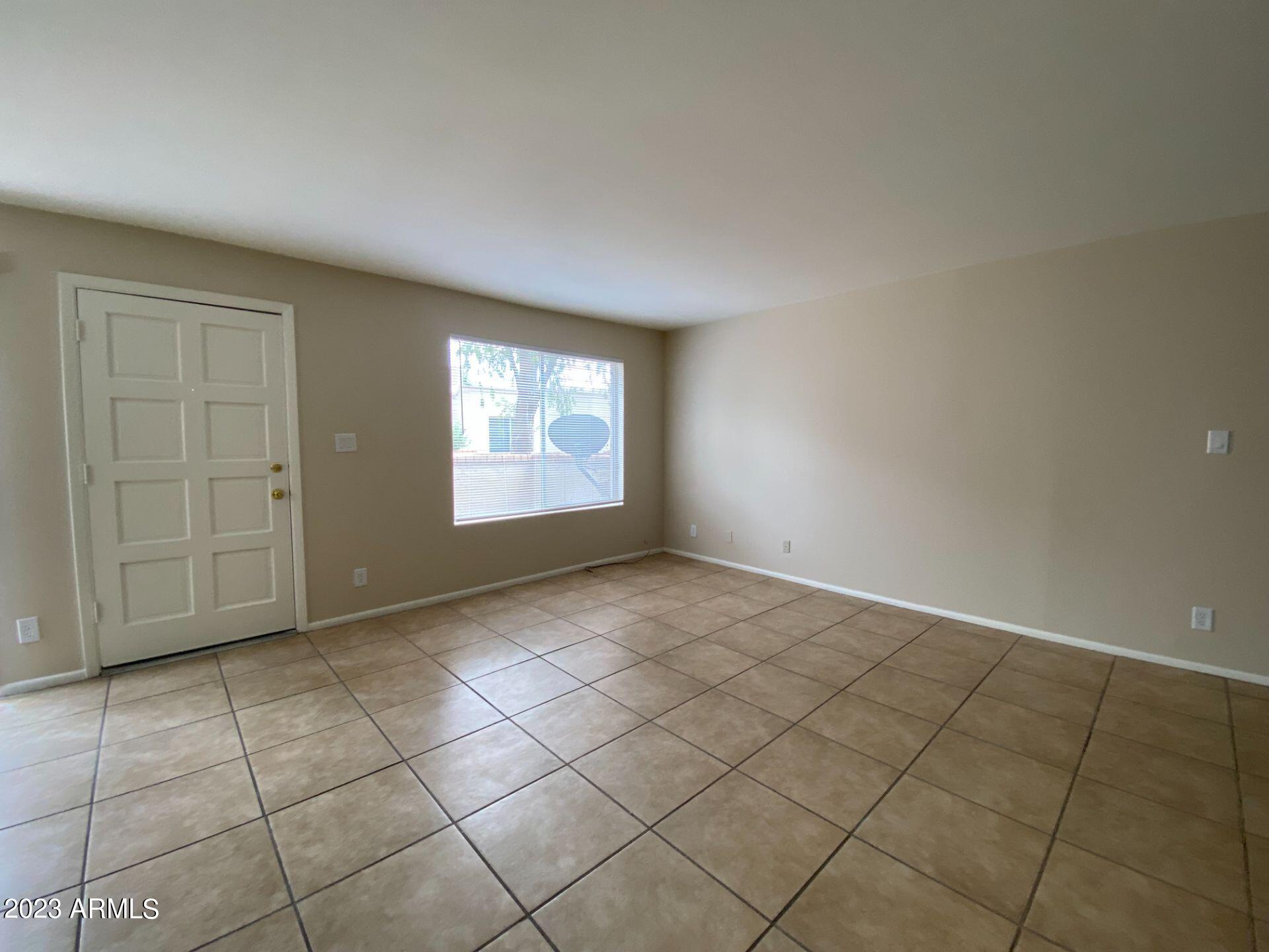 17024 East Calle Del Oro, Unit B Fountain Hills, AZ 85268 - Photo 2 of 22 an empty room with windows