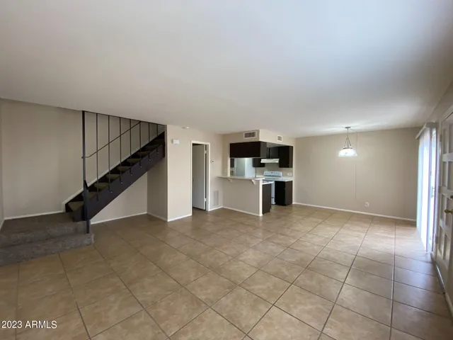 a view of kitchen with microwave and stove top oven