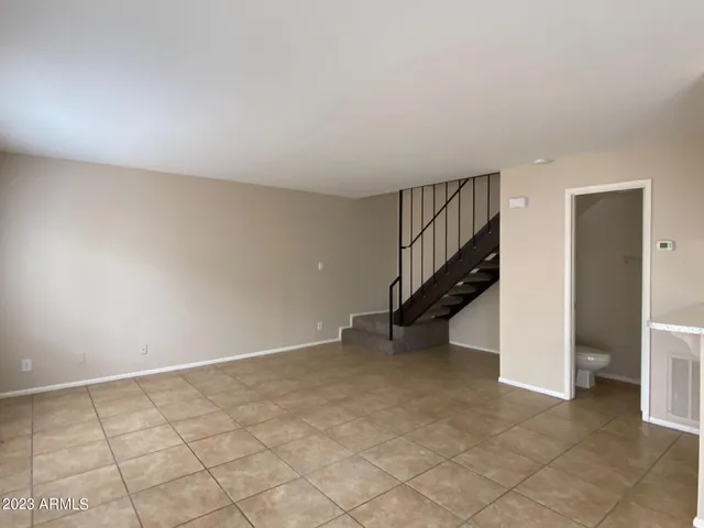 a view of an empty room with stairs