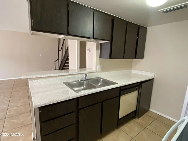 a kitchen with a sink and cabinets